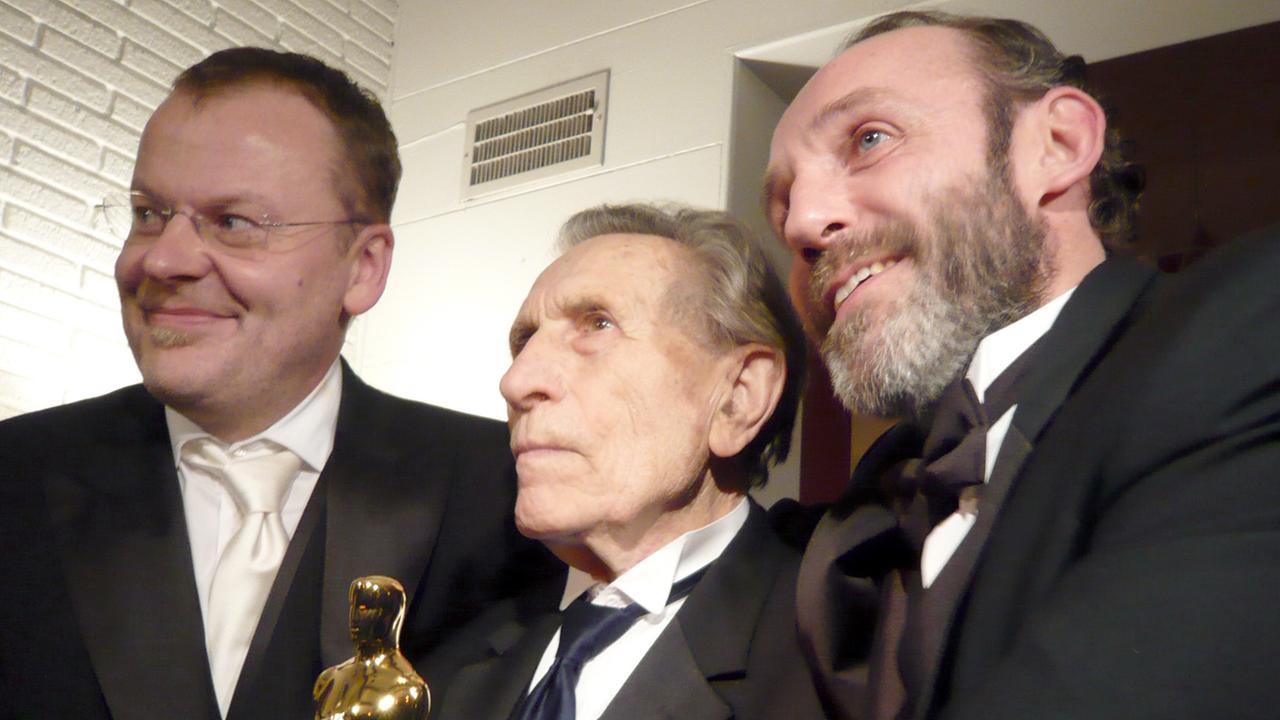 Stefan Ruzowitzky, Adolf Burger, Karl Markovics bei der Oscarverleihung 2008