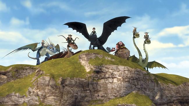 Die Reiter von Berk sitzen auf ihren Drachen auf einer Felsklippe.