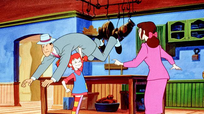 Pippi Langstrumpf hebt einen Herren, den Angeber Tom, mit einem Arm hoch.