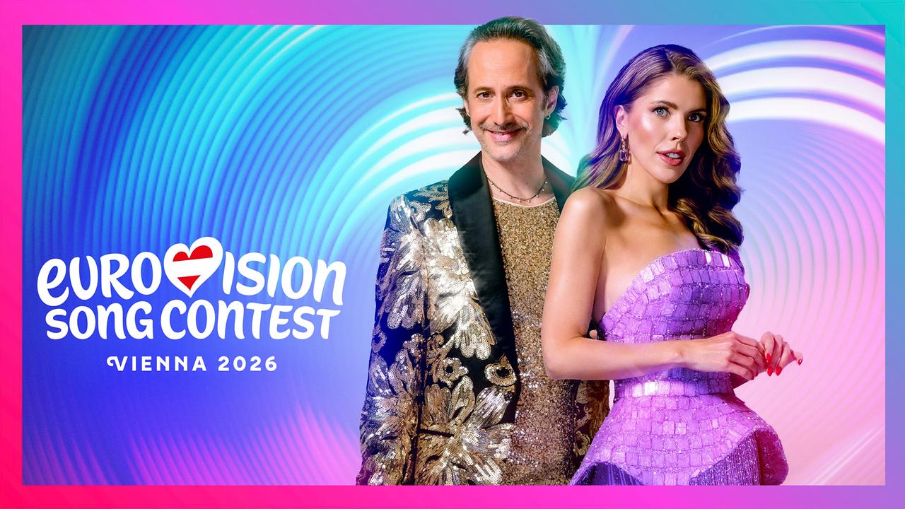 © ORF/Hans Leitner Farbenfrohes Promo‑Motiv mit Michael Ostrowski und Victoria Swarovski vor einem grafischen Hintergrund, auf dem der Schriftzug „Eurovision Song Contest – Vienna 2026“ steht.