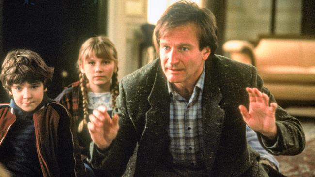 Im Bild: Bradley Pierce (Peter), Kirsten Dunst (Judy), Robin Williams (Alan Parrish).