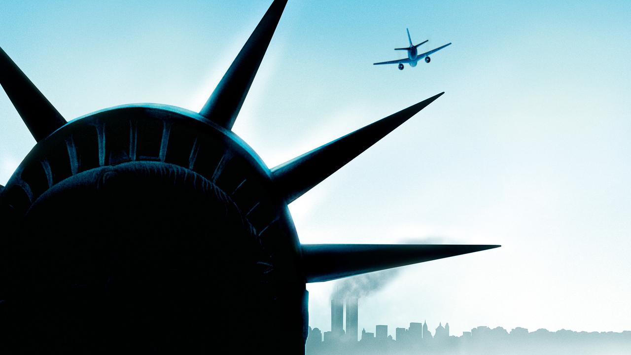 Fotomontage - Hinter der Silhoutte der Freiheitsstatue ist ein Passagierflugzeug auf dem Kurs nach New York - am Horizont Skyline mit rauchenden World Trade Center-Türmen