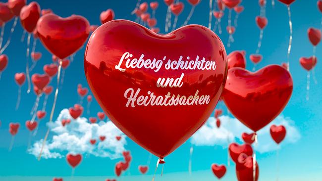 Liebesg'schichten und Heiratssachen rote Herzluftballons