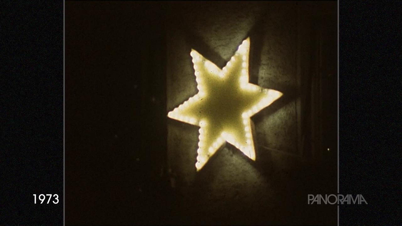 Im Bild aus dem Jahr 1973 ist ein beleuchteter Weihnachtstern an einer Wand zu sehen.