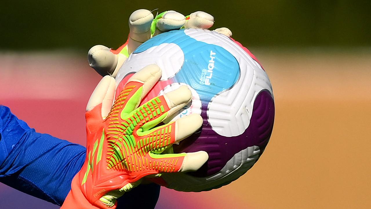 © France's goalkeaper Pauline Peyraud-Magnin stops the ball during a training session at the team's base camp in Ashby-de-la-Zouch in central England, on July 5, 2022, during the UEFA Euro 2022 football tournament