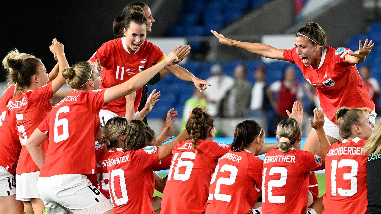 Austria's teammates celebrate winning at the end of the UEFA Women's Euro 2022 Group A football match between Austria and Norway at Brighton and Hove Community Stadium in Brighton, Southern England on July 15, 2022. Austria won 1 - 0 against Norway. The Nowegian team is knocked out of the UEFA Women's Euro 2022 while the Austrian one will compete in the quarter finals