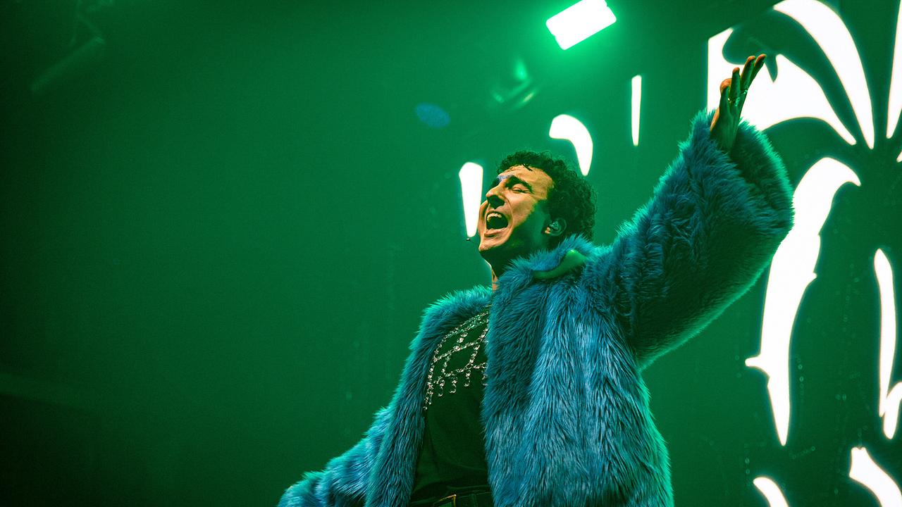 COSMÓ in a blue faux fur coat at the performance at the "London Eurovision Party"