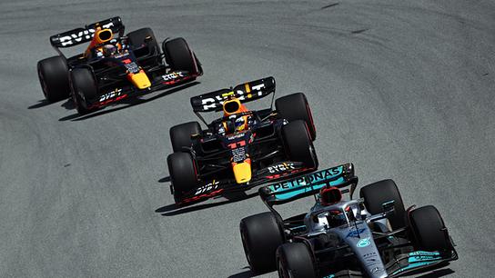 Red Bull's Dutch driver Max Verstappen, Red Bull's Mexican driver Sergio Perez and Mercedes' British driver George Russell compete during the Spanish Formula One Grand Prix at the Circuit de Catalunya on May 21, 2022 in Montmelo, on the outskirts of Barcelona.