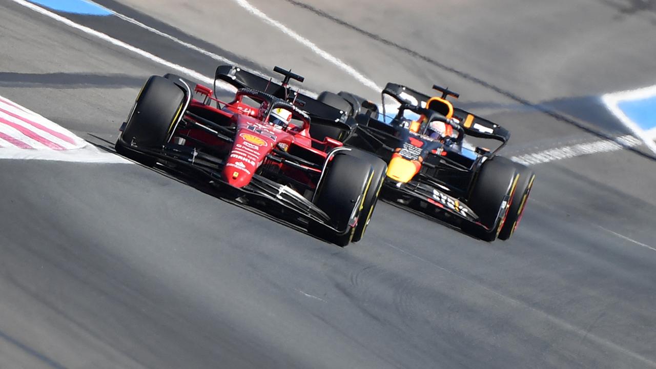 Ferrari's Monegasque driver Charles Leclerc races ahead of Red Bull Racing's Dutch driver Max Verstappen during the French Formula One Grand Prix at the Circuit Paul-Ricard in Le Castellet, southern France, on July 24, 2022.