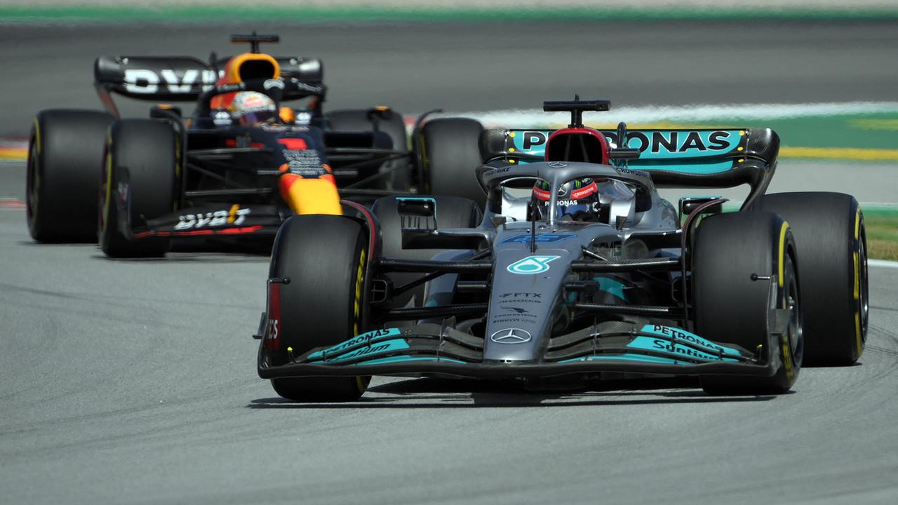 Mercedes' British driver George Russell drives ahead of Red Bull's Dutch driver Max Verstappen during the Spanish Formula One Grand Prix at the Circuit de Catalunya on May 21, 2022 in Montmelo, on the outskirts of Barcelona.
