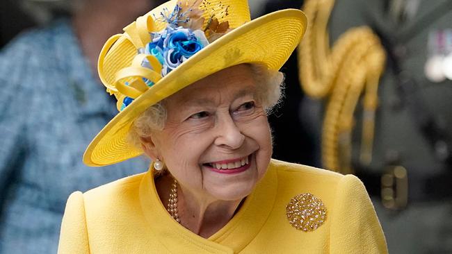 Britain's Queen Elizabeth II reacts during her visit to Paddington Station in London on May 17, 2022, to mark the completion of London's Crossrail project, ahead of the opening of the new 'Elizabeth Line' rail service next week