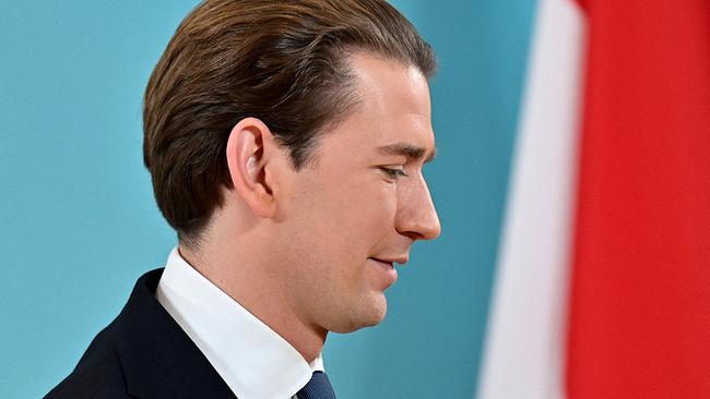 Former Austrian Chancellor Sebastian Kurz leaves after giving a press conference in Vienna, on December 2, 2021. Kurz, long hailed a political whizz kid until resigning after being implicated in a corruption investigation, announced he is leaving politics