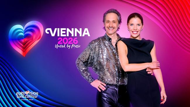 Michael Ostrowski und Victoria Swarovski posieren vor einem bunten Sujet für den Eurovision Song Contest 2026 in Wien mit dem Slogan "United by Music".