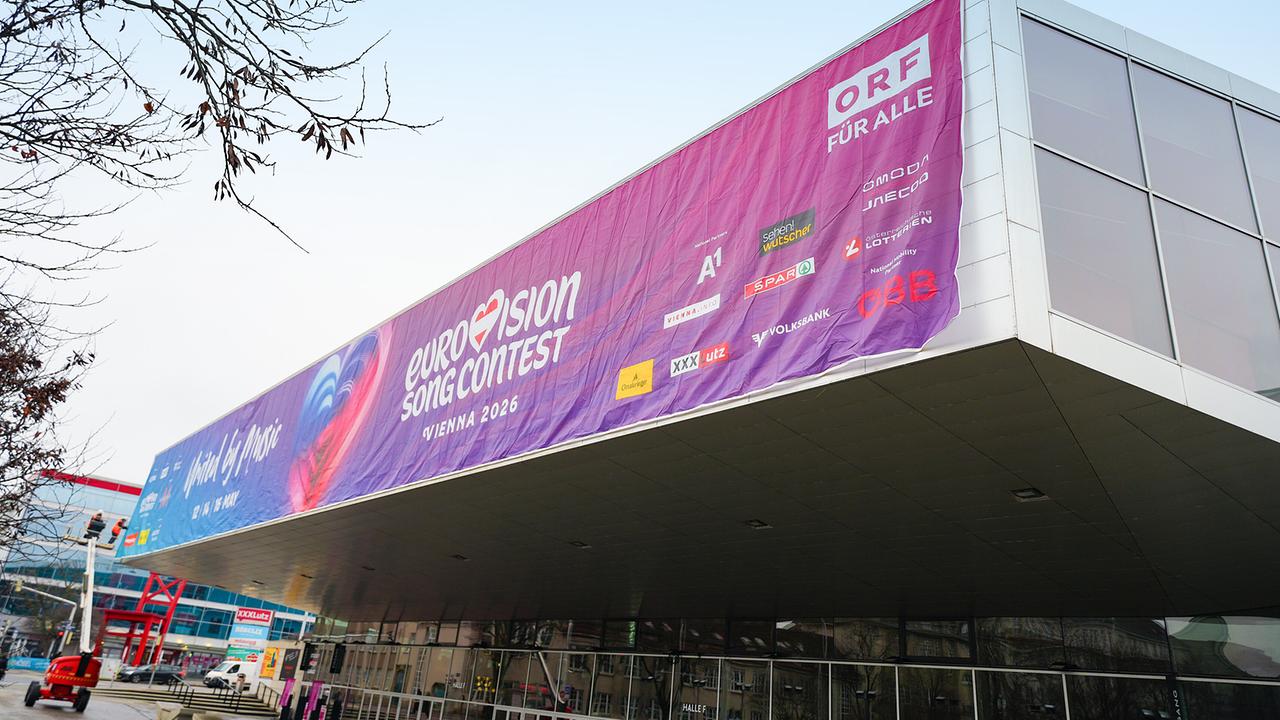 © ORF/Roman Zach-Kiesling View of the Wiener Stadthalle, where the canopy is draped with a large banner for the "Eurovision Song Contest – Vienna 2026" with ORF branding.